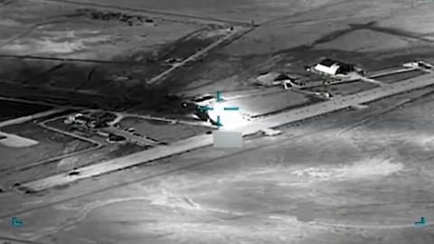  black and white aerial view of an airfield AI is helping U.S. forces find and choose targets in Iran, like this airfield. U.S. Central Command via AP